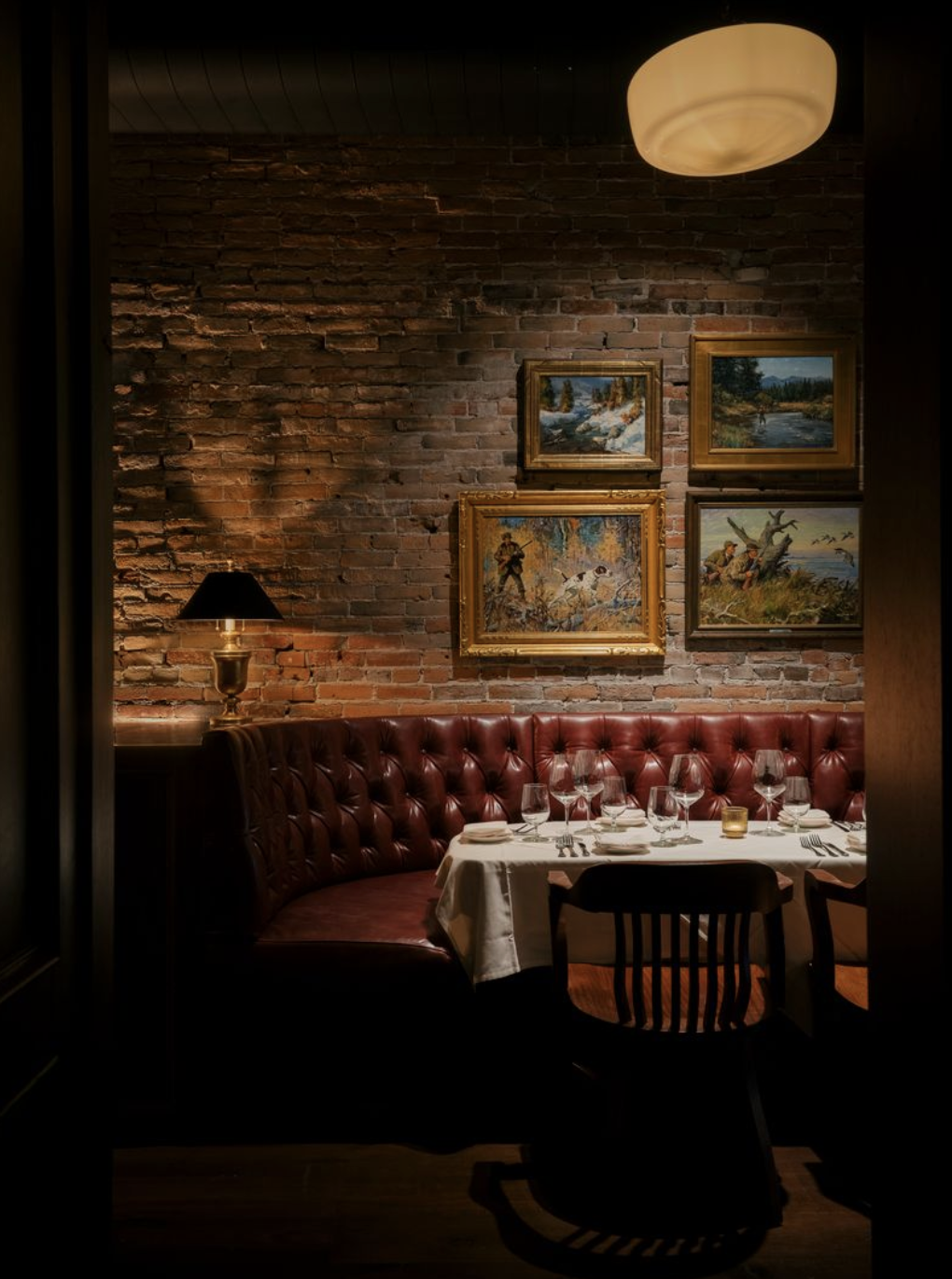 JWH-10-J.W._Heist-dining-room-exposed-brick-western-art.png