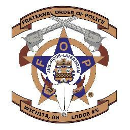 Badge with a sheriff's star, a fox skull, and police insignia, with banners reading 'FRATERNAL ORDER OF POLICE' and 'WICHITA, KS LOUGE #5'.