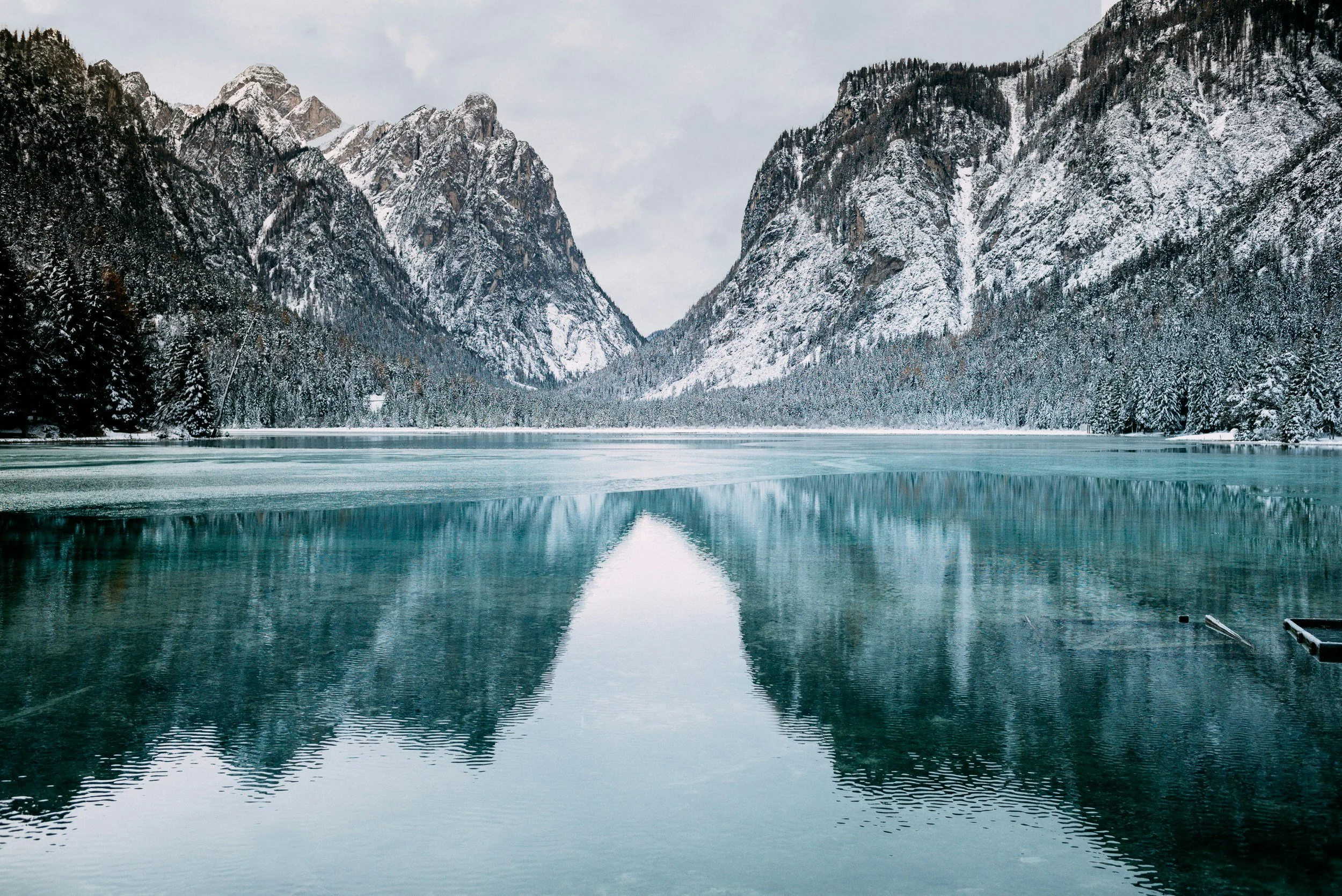 Mountain peeks reflected in a lake.