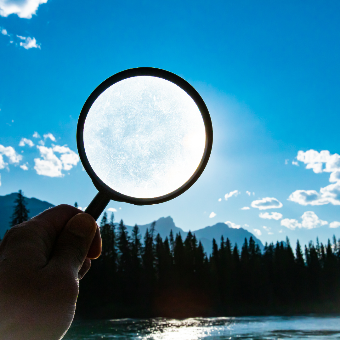 Magnifying glass aimed at the moon.