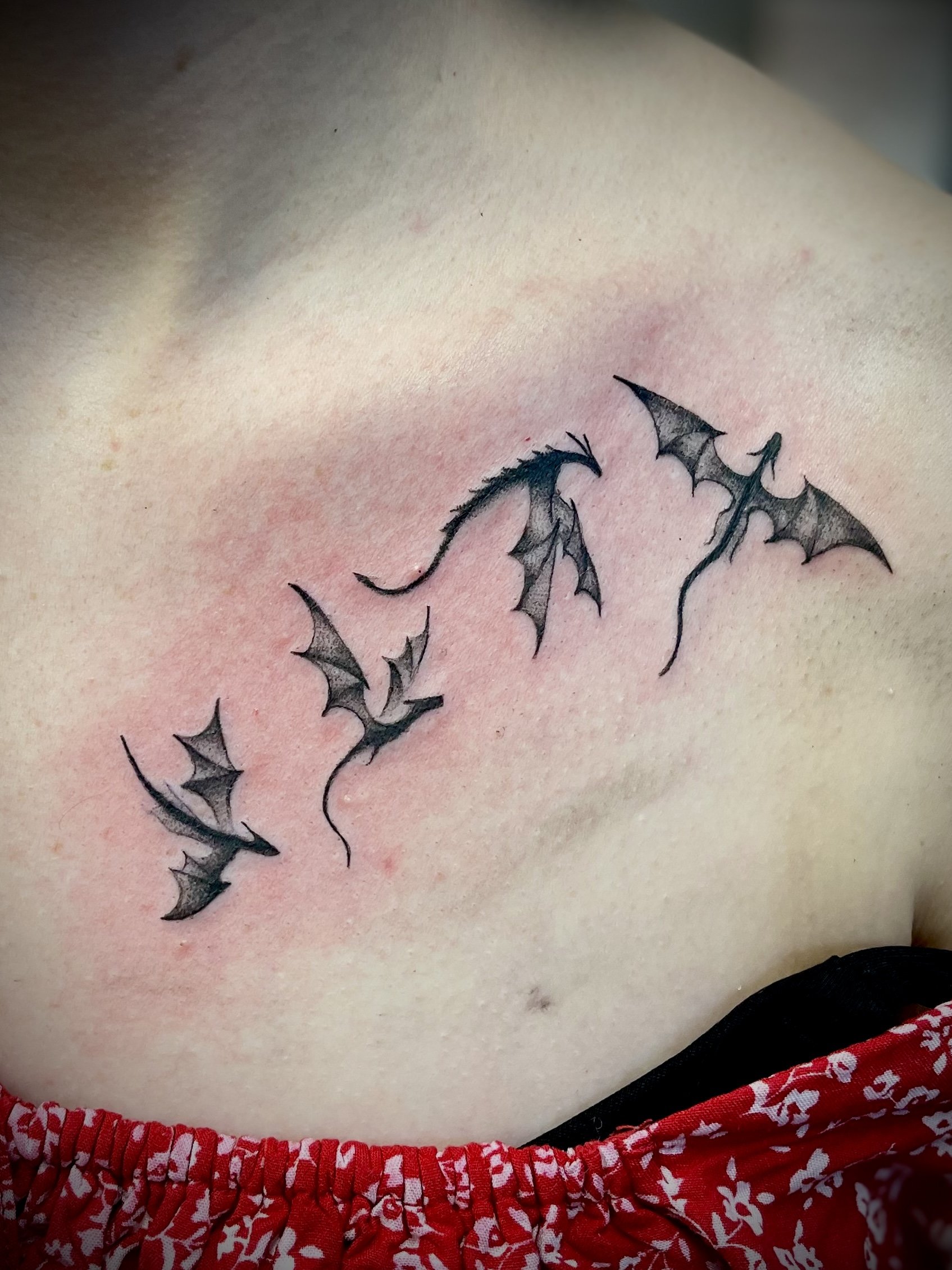 Fine line black and grey dragon tattoo designed by Leasy Tattoo Newcastle