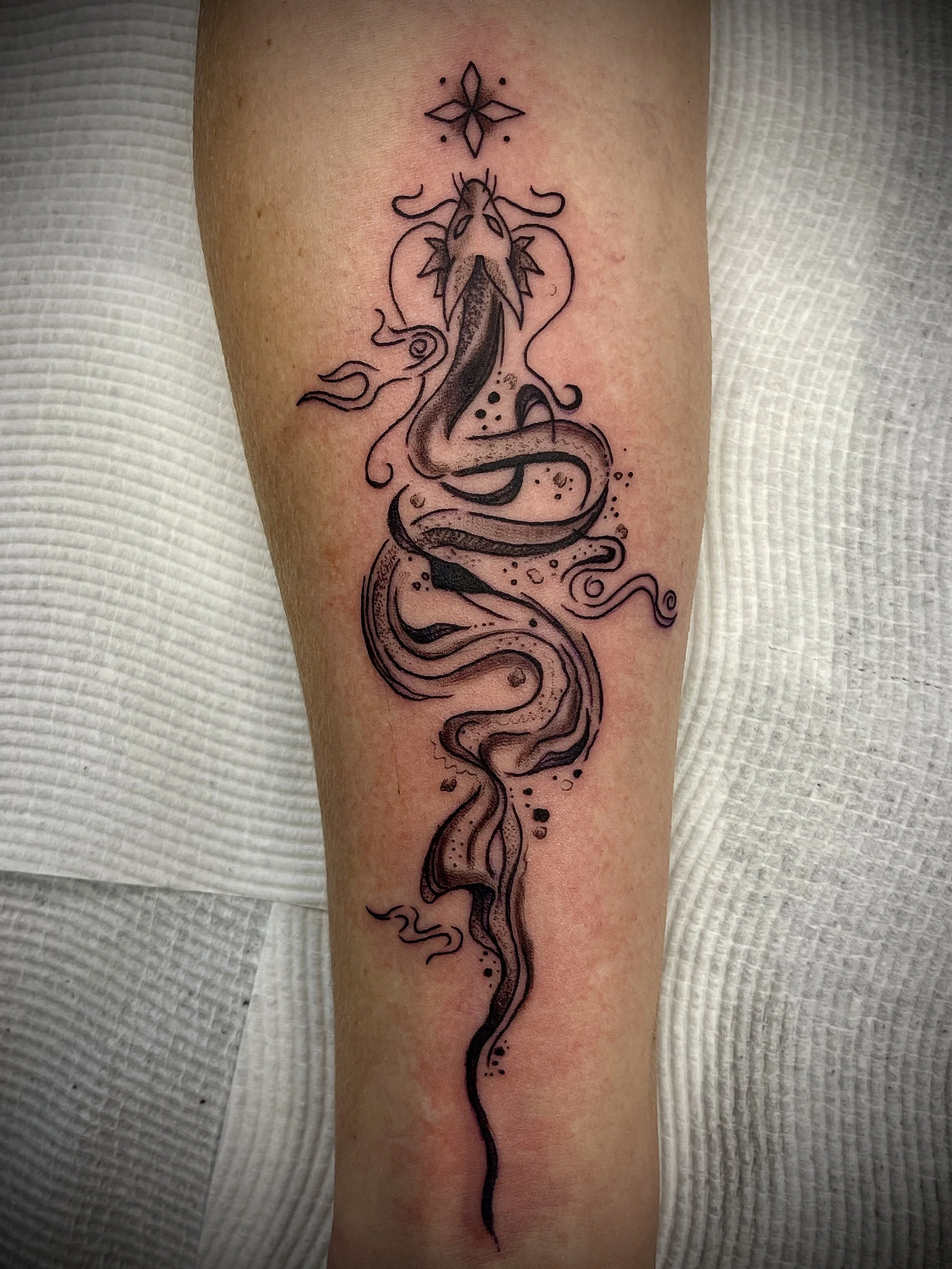 Fine line black and grey dragon tattoo designed by Leasy Tattoo