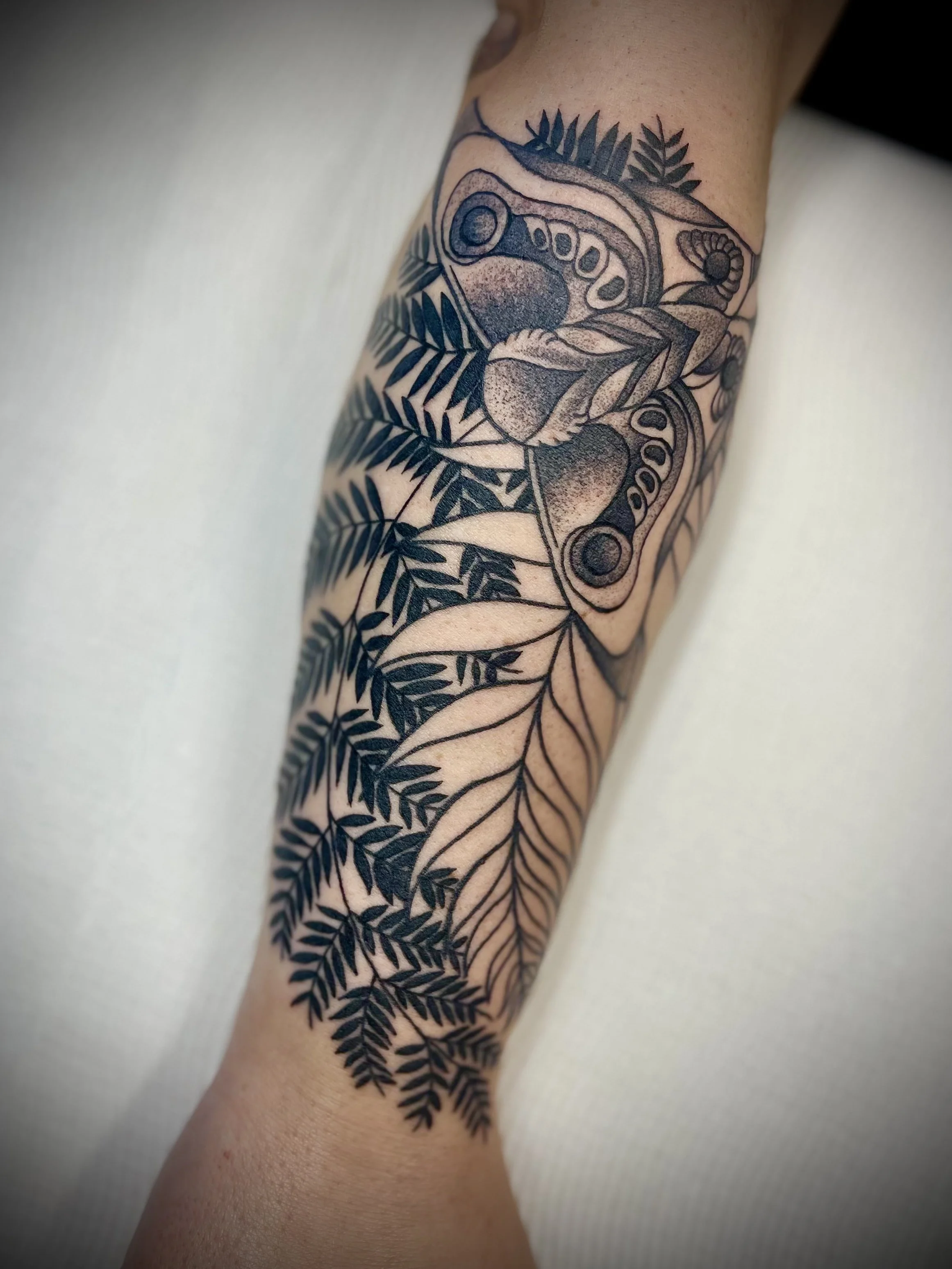 Black and grey floral and moth tattoo designed by Leasy Tattoo Newcastle