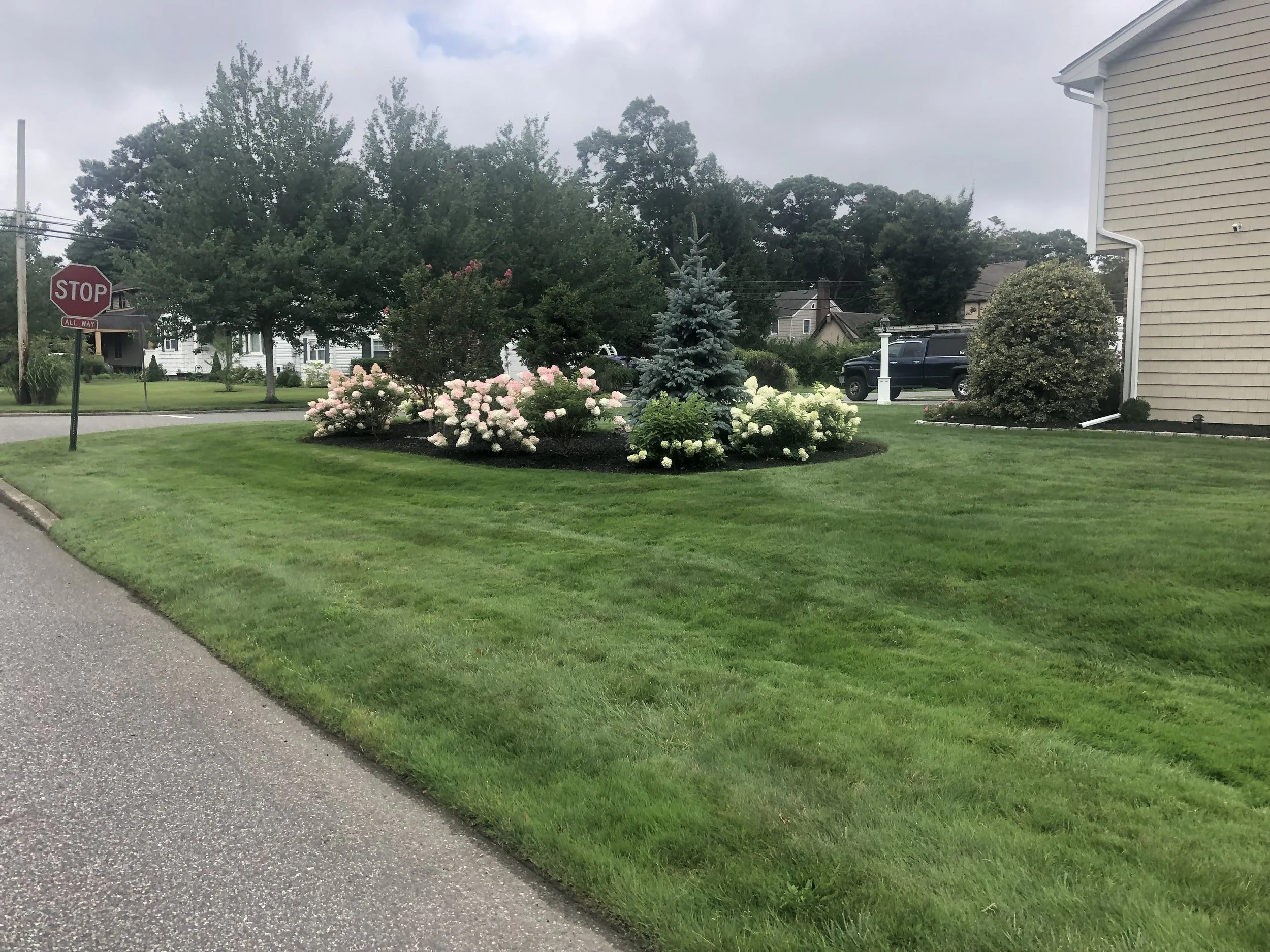Here you can see how beautiful your property can look by adding some color. Seasonal flowers and perennials will are a good choice for any landscape design.