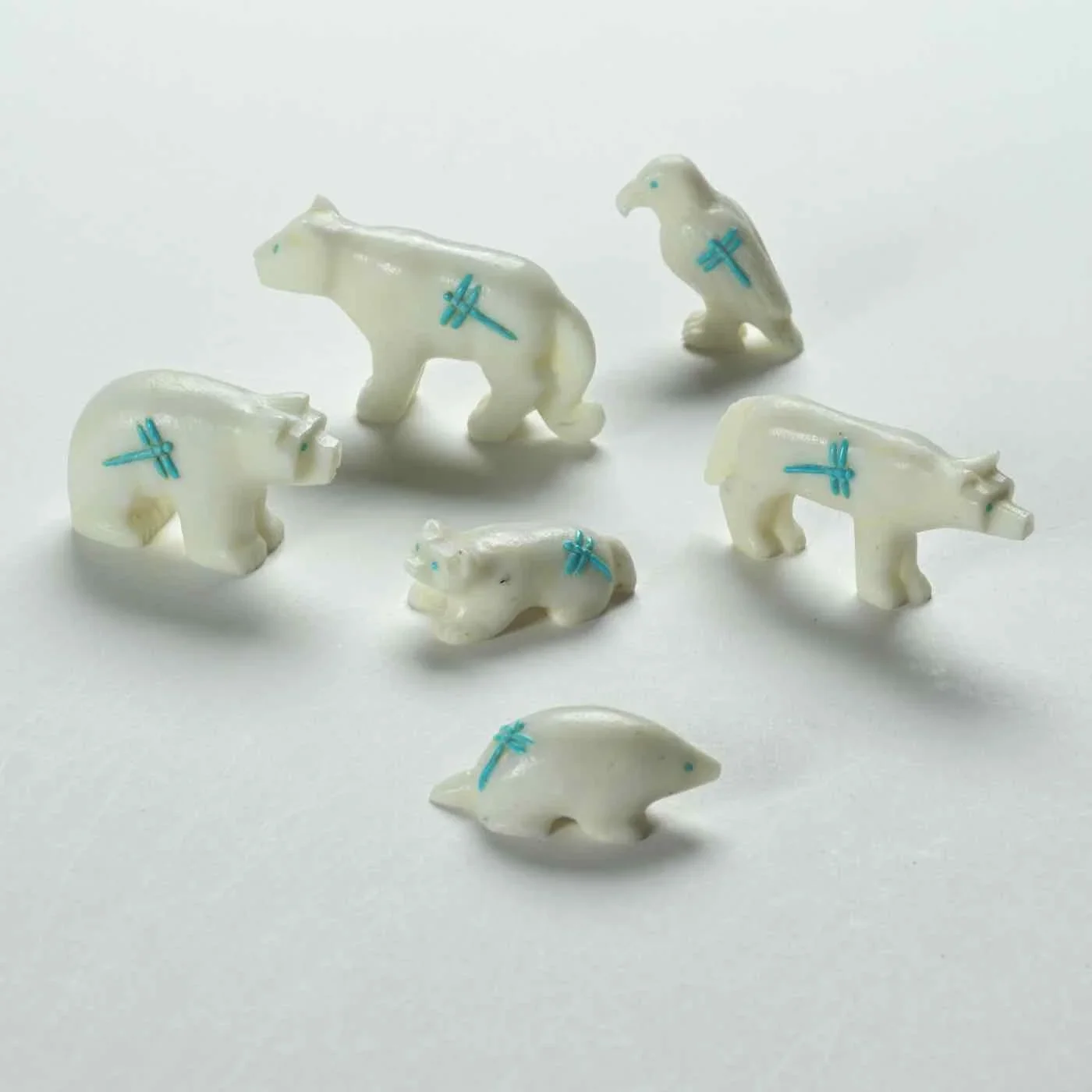 Clissa Martin's carvings of the Six Directions with blue dragonflies