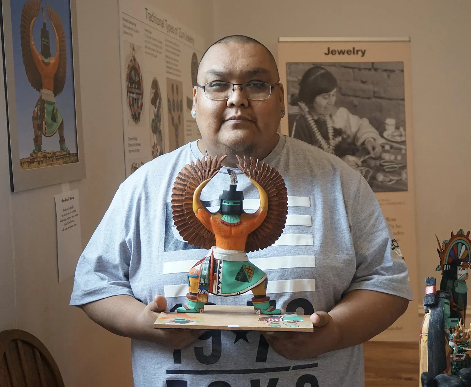 Robert Cachini Jr with Knifewing Carving at the Zuni Show