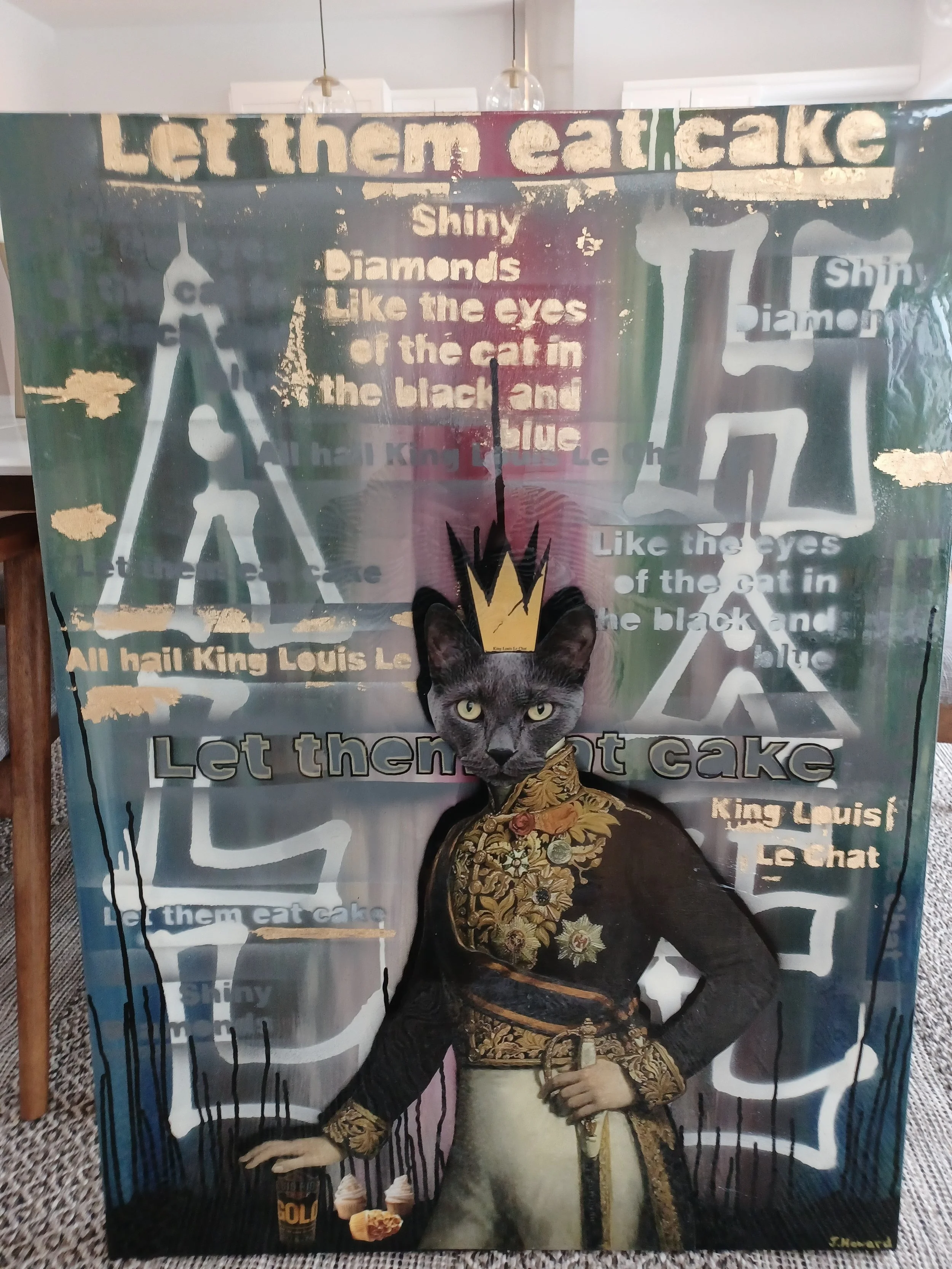 Image of a cat with a human body dressed in ornate clothing, wearing a crown, and standing in front of a colorful background with advertising phrases about cake, with a larger picture of a cat's face on top of the figure's head.