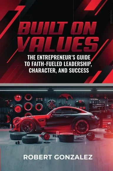 Cover of a book titled 'Built on Values: The Entrepreneur's Guide to Faith-Fueled Leadership, Character, and Success' by Robert Gonzalez. The cover features a red sports car in a garage or workshop with tires and tools, with a dark background and red accents.