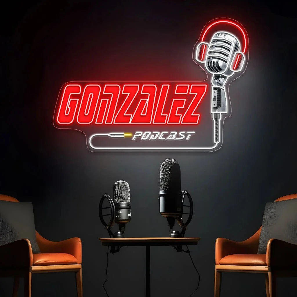 Neon sign reading 'GONZALEZ PODCAST' with a microphone and headphones illustration, two microphones on a table, and two orange chairs in a podcast studio setting.