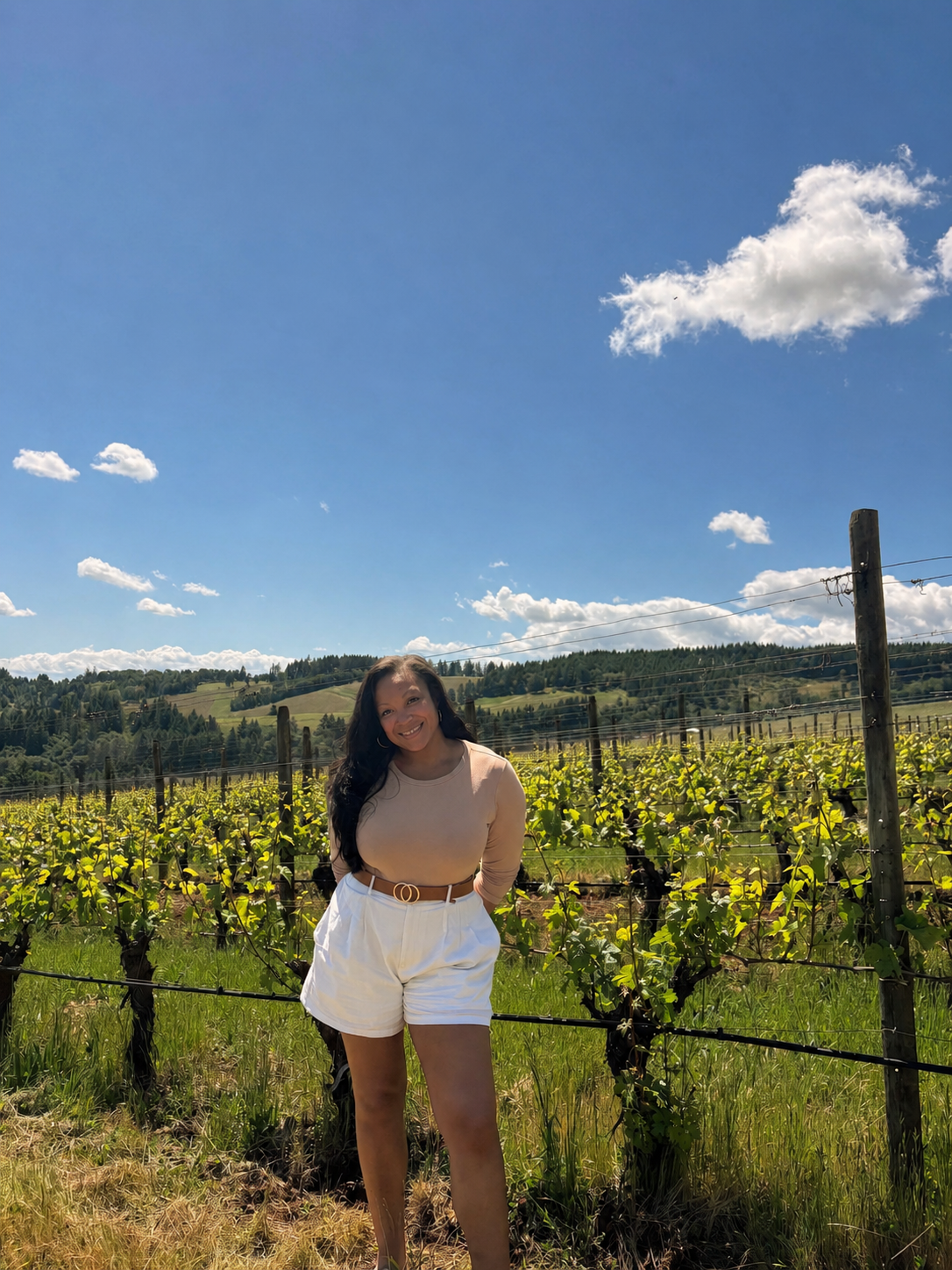 Asia Foreman in vineyard with rolling hills in the background