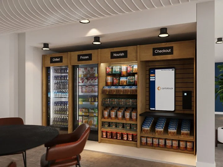 A modern self-serve grocery kiosk with four sections labeled 'Chilled,' 'Frozen,' 'Nourish,' and 'Checkout.' The sections contain refrigerated and shelving units with assorted food products, and an electronic screen for digital transactions. There is