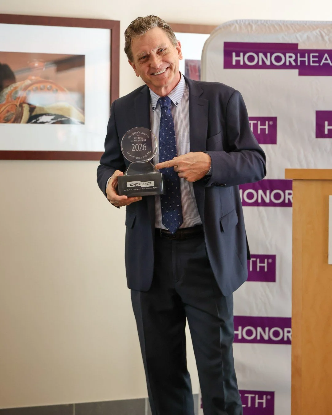 Dr. Dohring receiving Honor Health Lifetime Impact Award