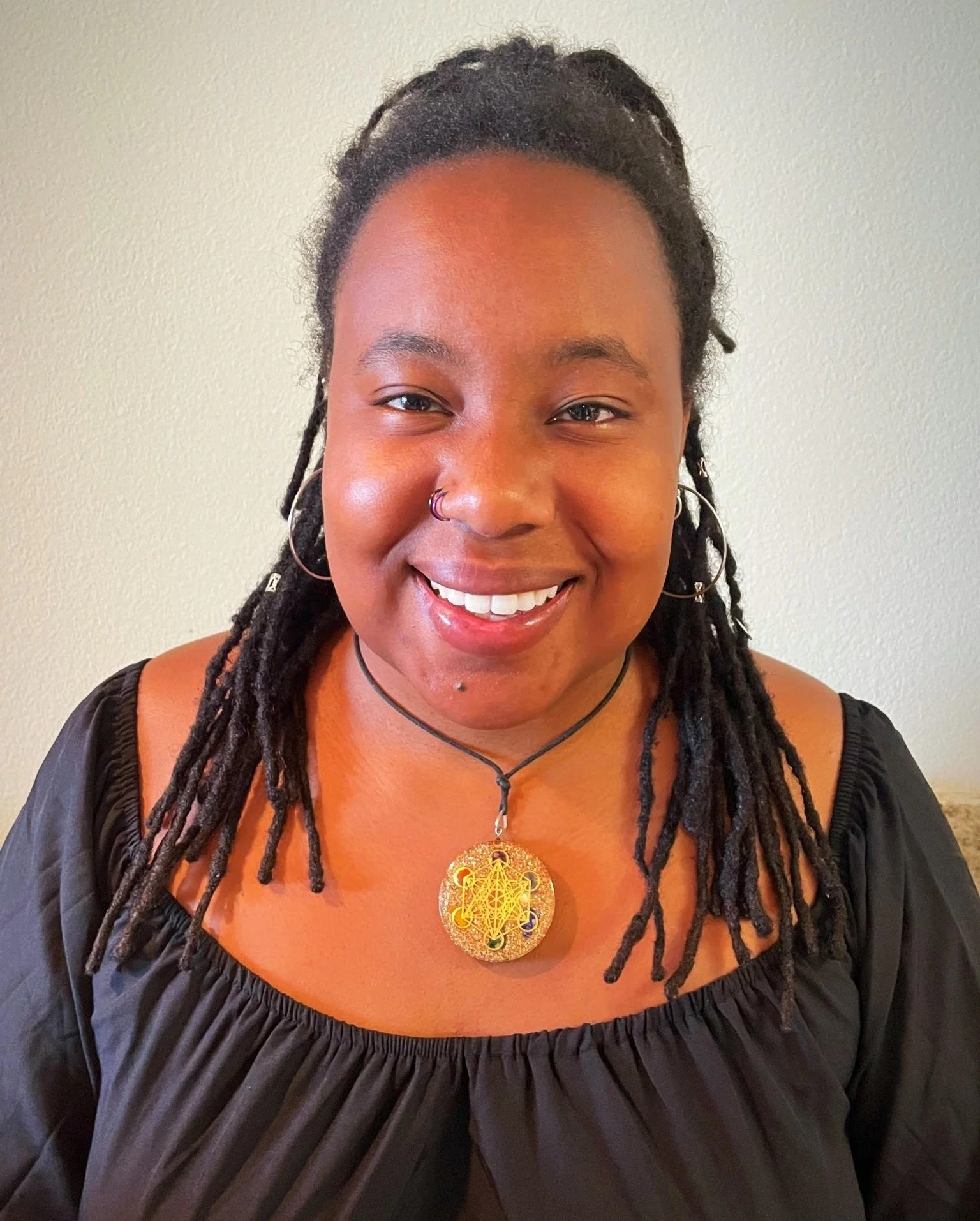Image of black queer therapist, Dr. Mary Woodson, dual licensed in substance use and mental health counseling offerint telehealth therapy in NC, WI, and Co.