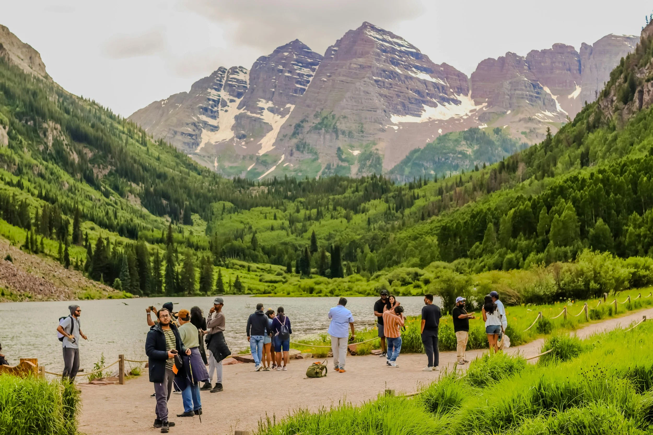 Aspen, Colorado, United States. Diverse Group of Hikers Enjoying Maroon Bells Scenic View, where queer black woman therapist Dr. Mary Woodson provides virtual telehealth therapy.