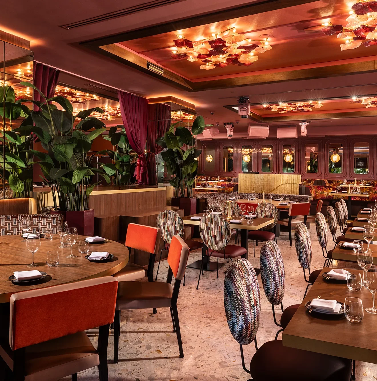 A modern restaurant dining room with copper colors and modern finishes