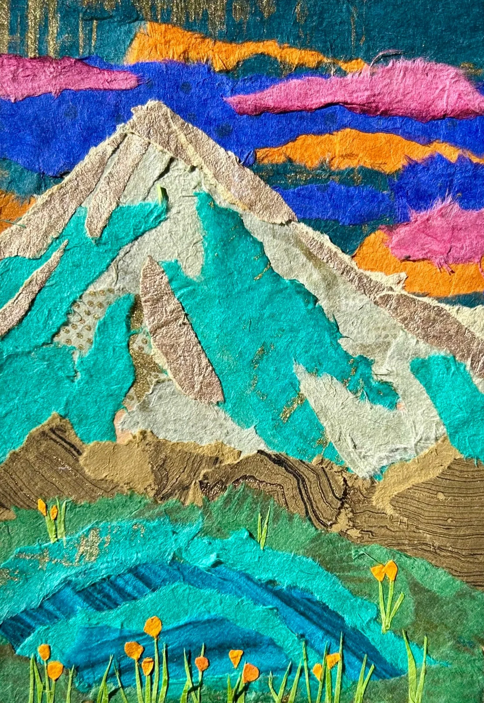 Colorful collage of a mountain landscape with a prominent snow-capped peak, vibrant sky with pink, orange, purple, and blue clouds, green rolling hills in the foreground, and flowers on the ground.