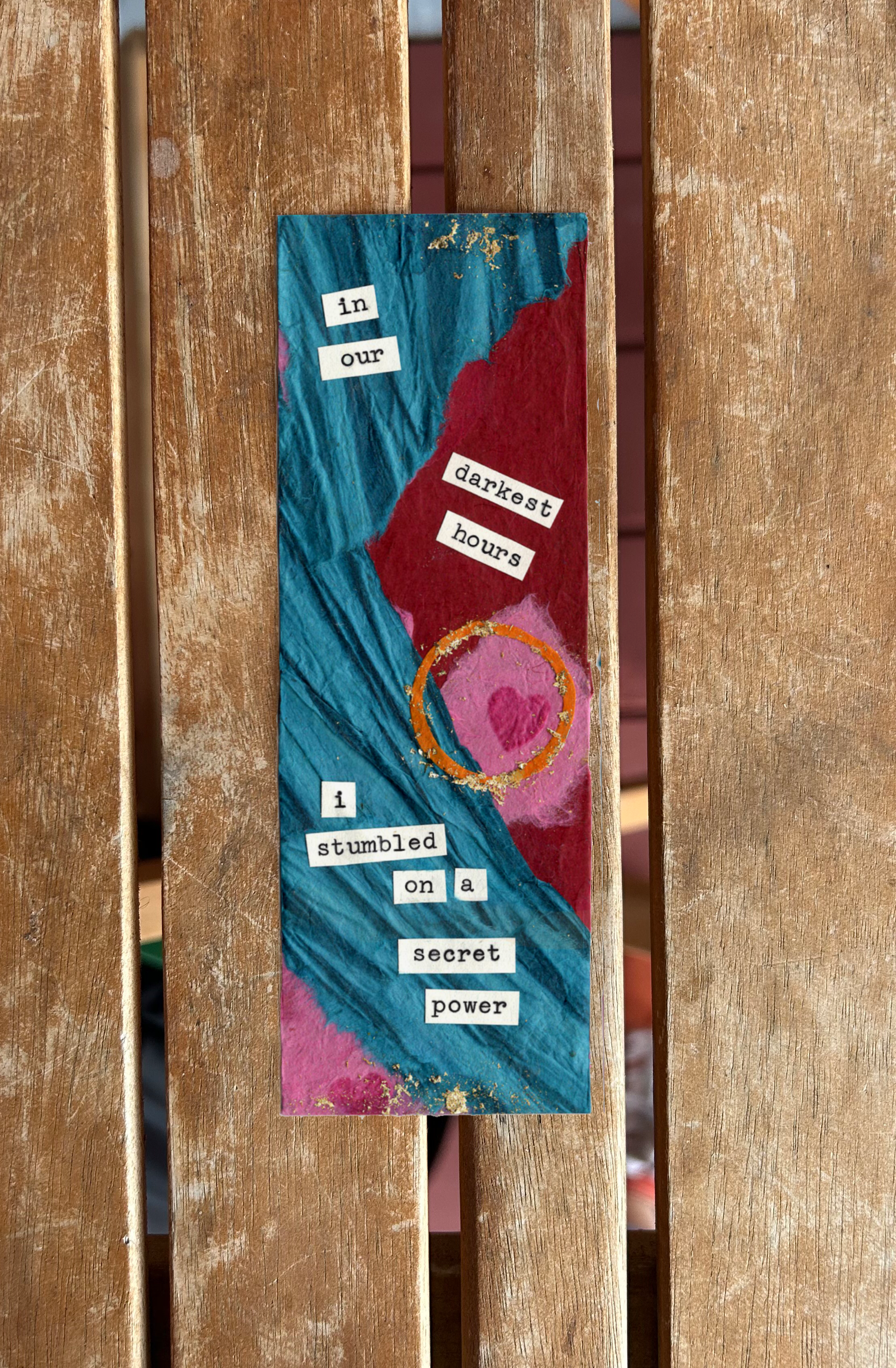 Colorful artistic collage with torn paper, painted circles, and a quote that says, 'In our darkest hours I stumbled on a secret power.'