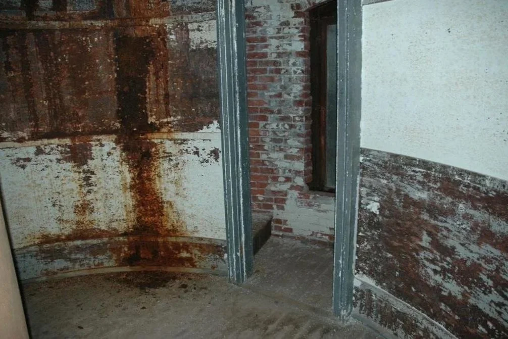 The before photo of the sleeping quarters of Middle Ground Lighthouse before its restoration.