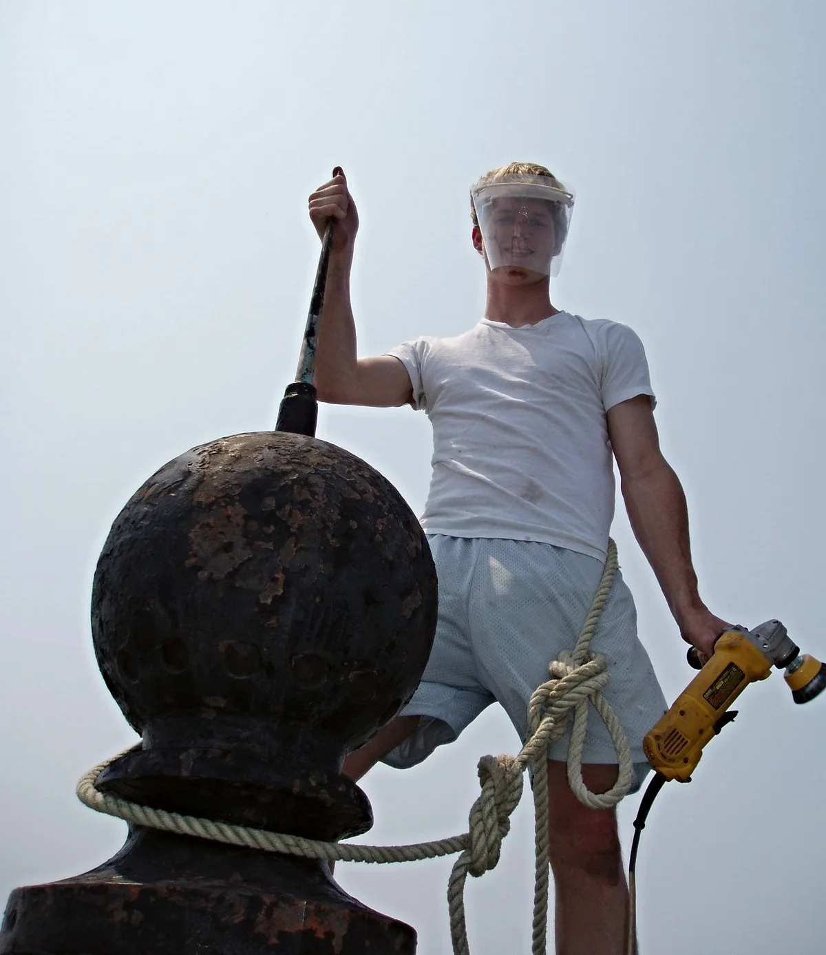A young worker at the very top of Middle Ground Lighthouse. 