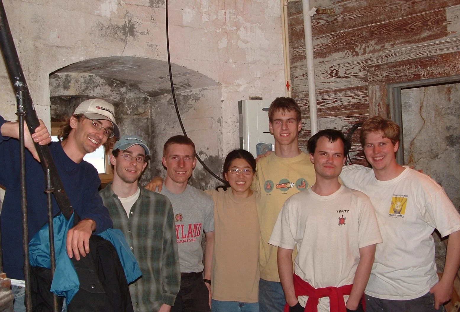 Group of workers in the cellar of Middle Ground Lighthouse. 