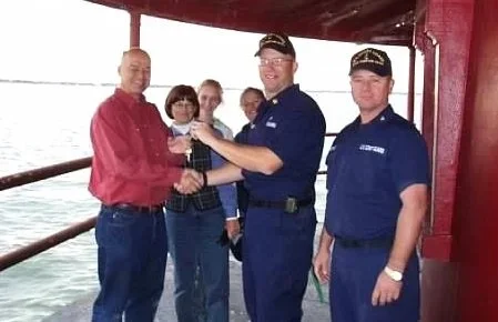 The United States Coast Guard handing over the keys to private ownership after auction.