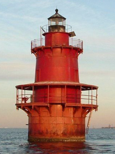 The before photo of the exterior of Middle Ground Lighthouse, before its restoration.