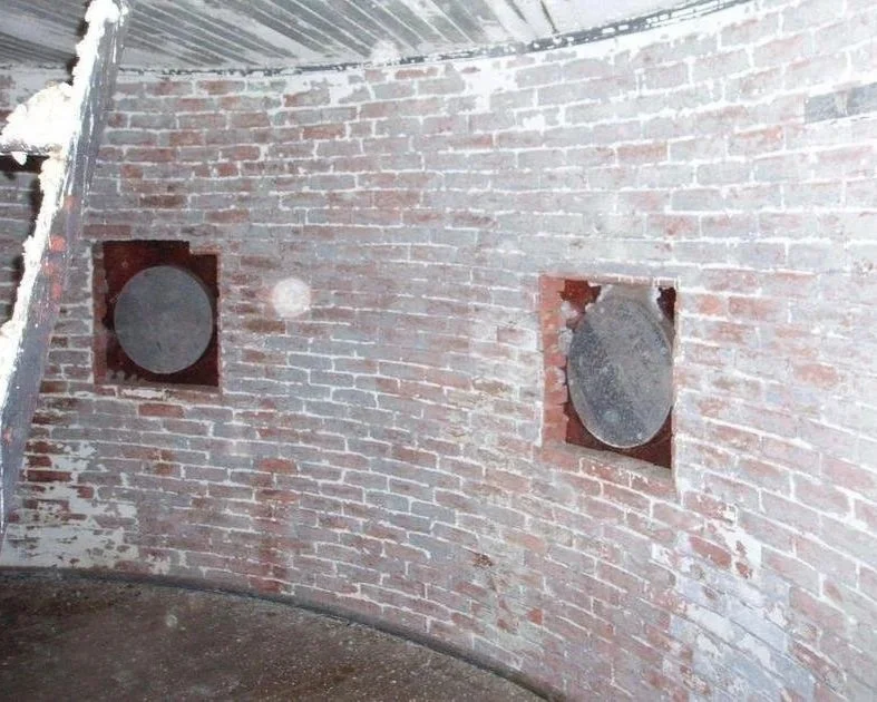 The before photo of the porthole room of Middle Ground Lighthouse before its restoration.