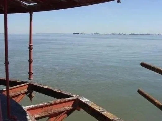 The before photo of the damaged deck of Middle Ground Lighthouse before its restoration.