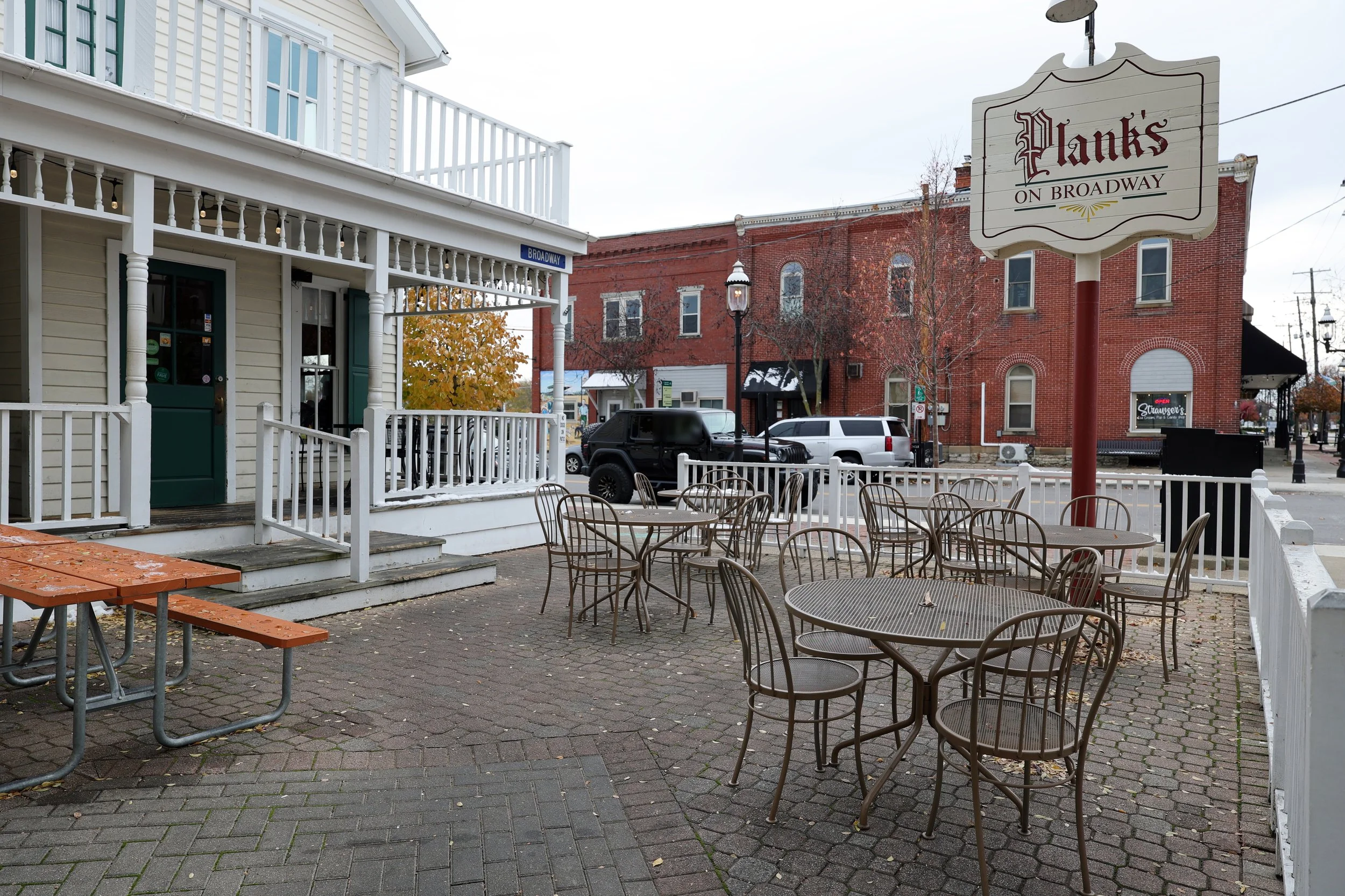 Outdoor patio with tables and chairs.