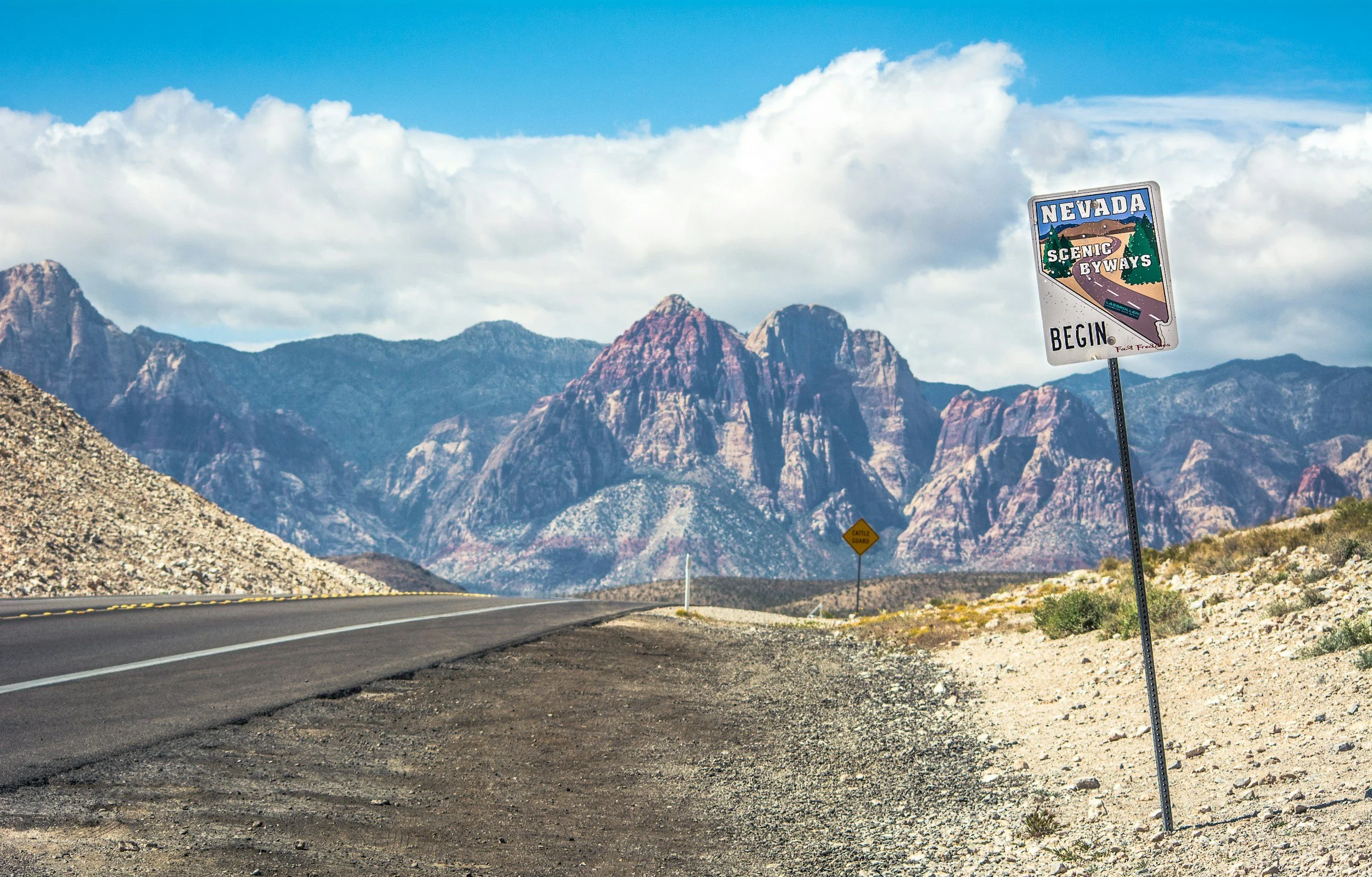 Nevada Scenic Route sign on road leading to the mountains