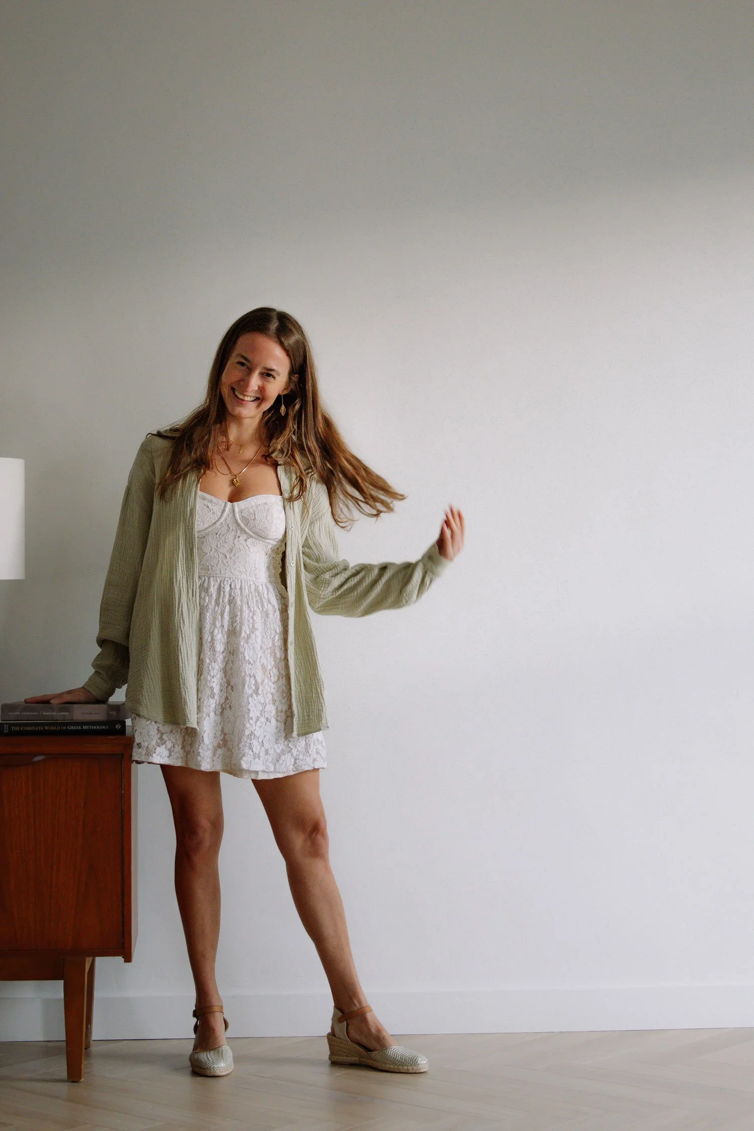 Rachelle Hicks, astrologer, smiling in a relaxed setting