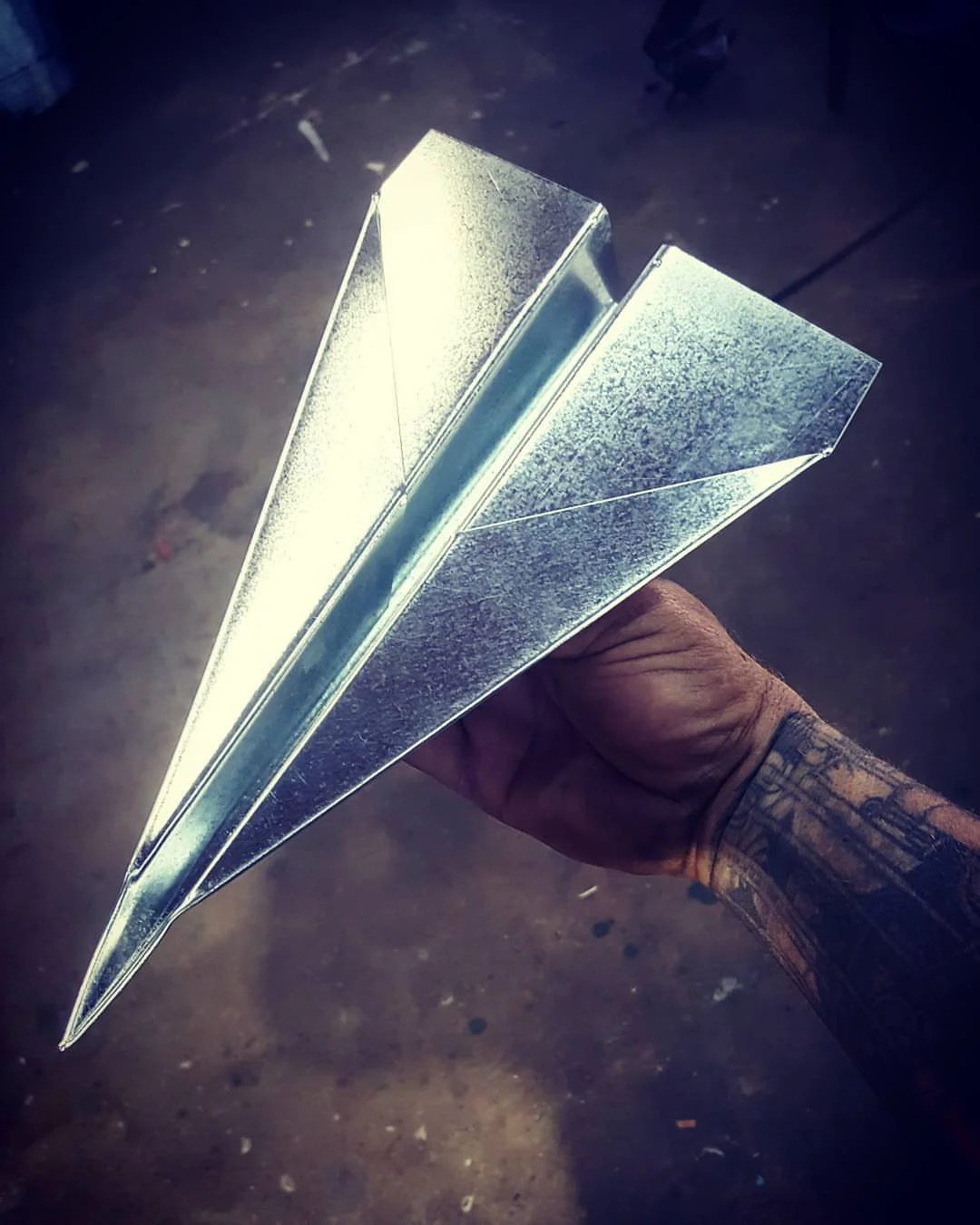 steel paper airplane.jpg