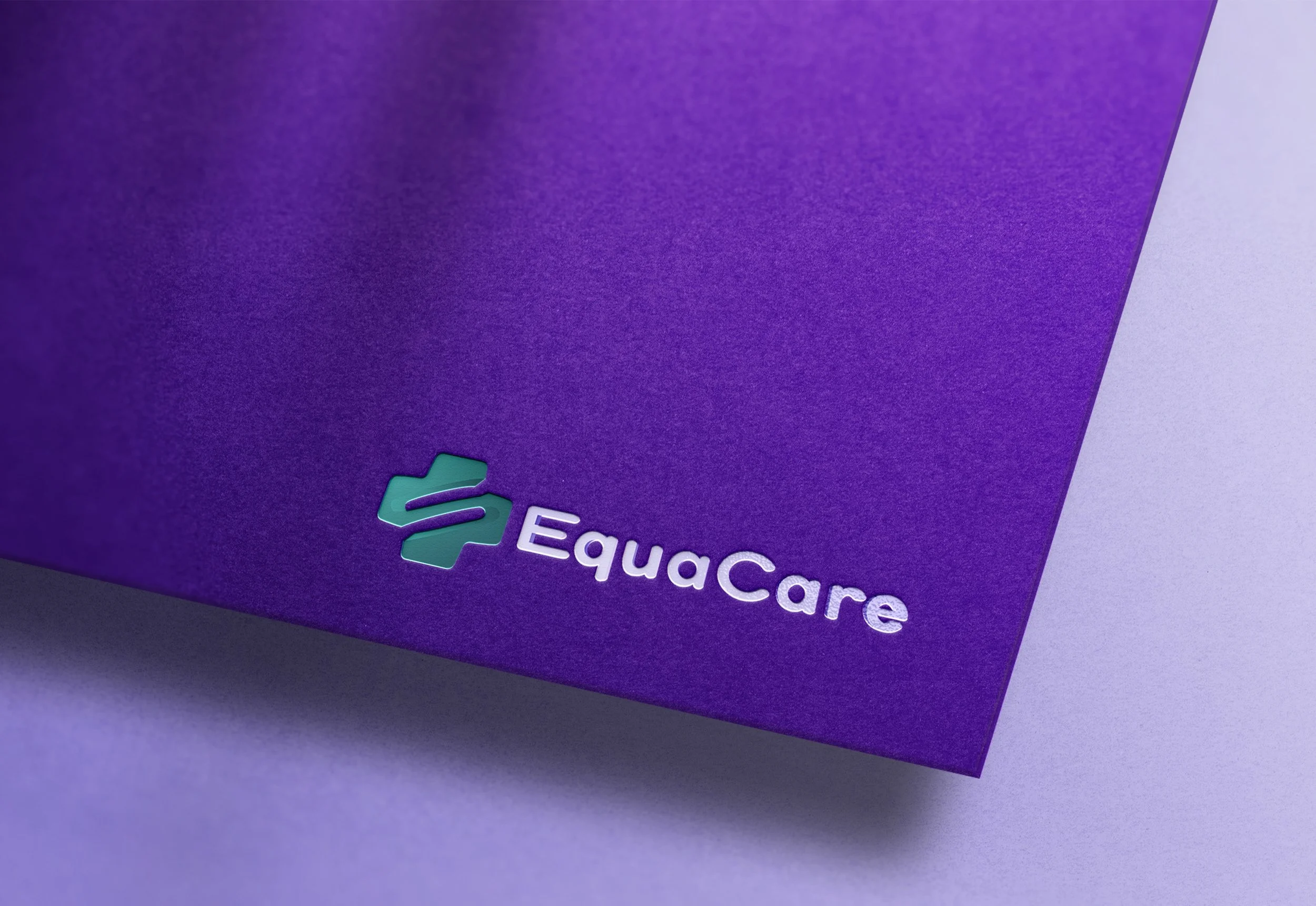 Close-up of a purple Equacare product packaging with the Equacare logo in white and green in the bottom left corner.