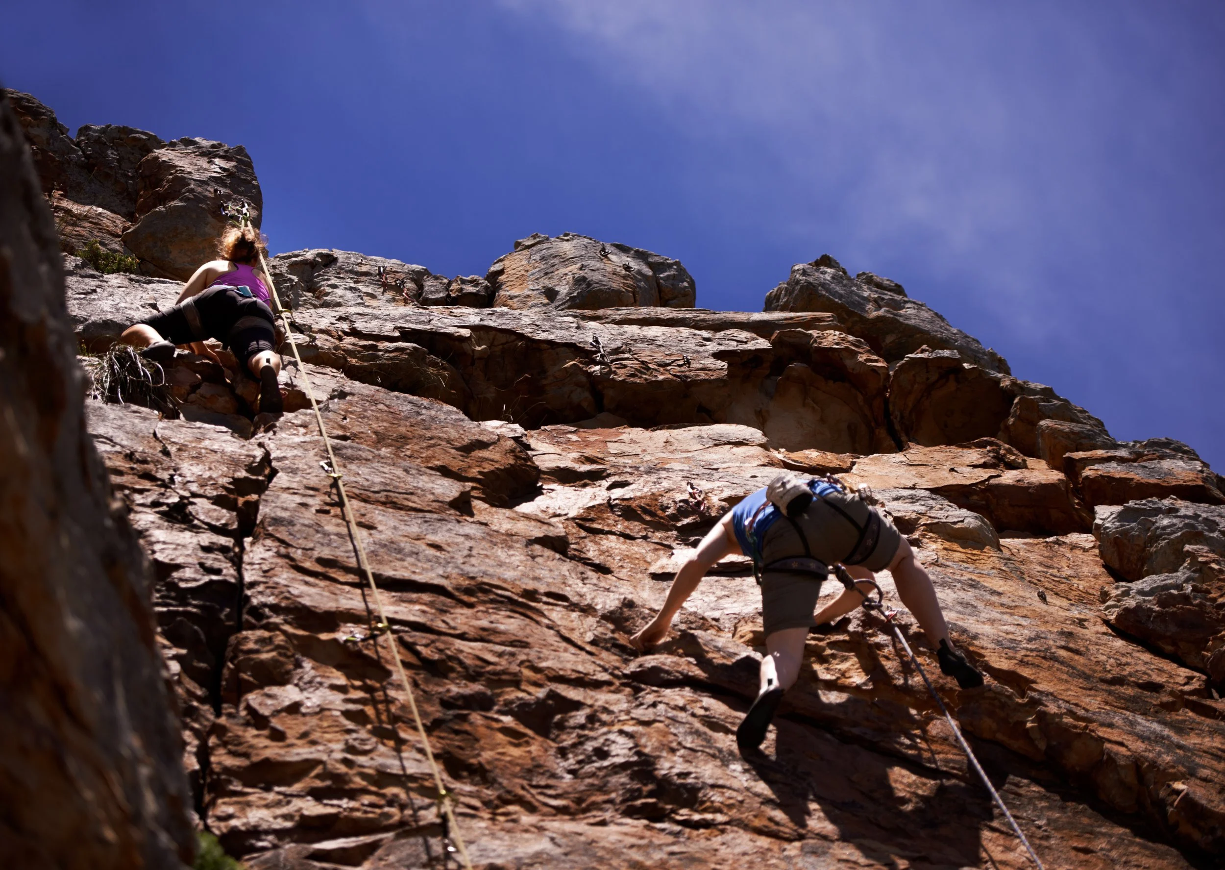 hikers-rock-climbing-outdoors-adventure-fitness-exercise-sun-extreme-sports-people-climb-wall-nature-wellness-mountain-fearless-activity-strength.jpg