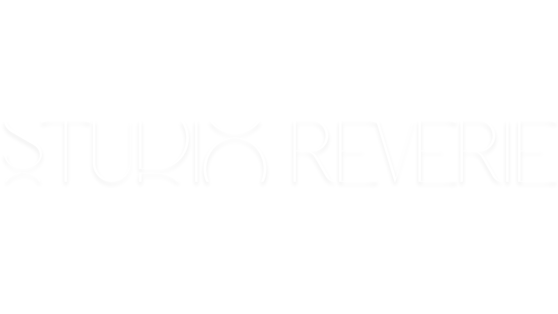 Black background with white text that says, 'STUDIO REVERIE' in a modern, stylized font.