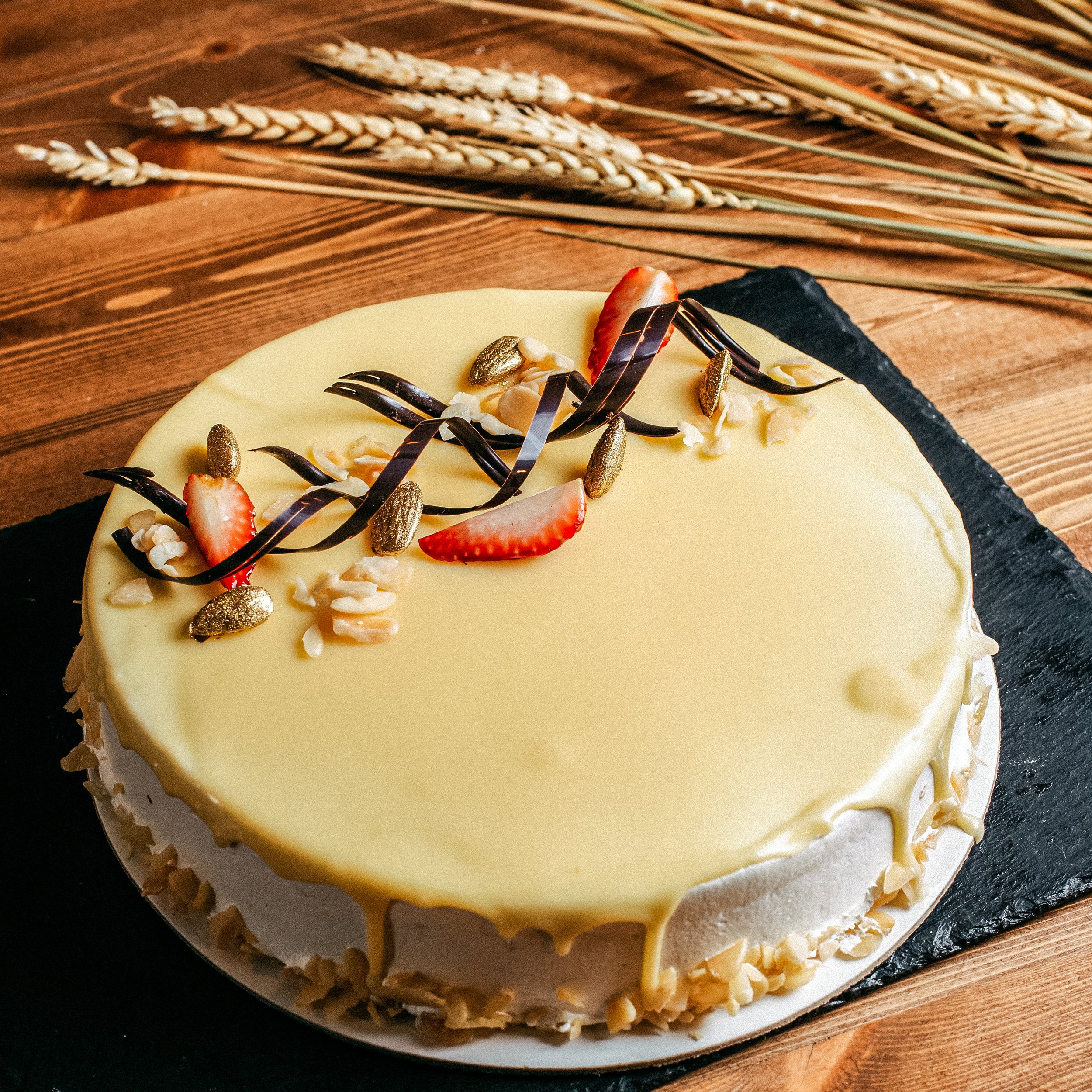 front-view-delicious-birthday-cake-decorated-yummy-round-inside-white-plate-birthday-sweet-cookie-brown-background.jpg