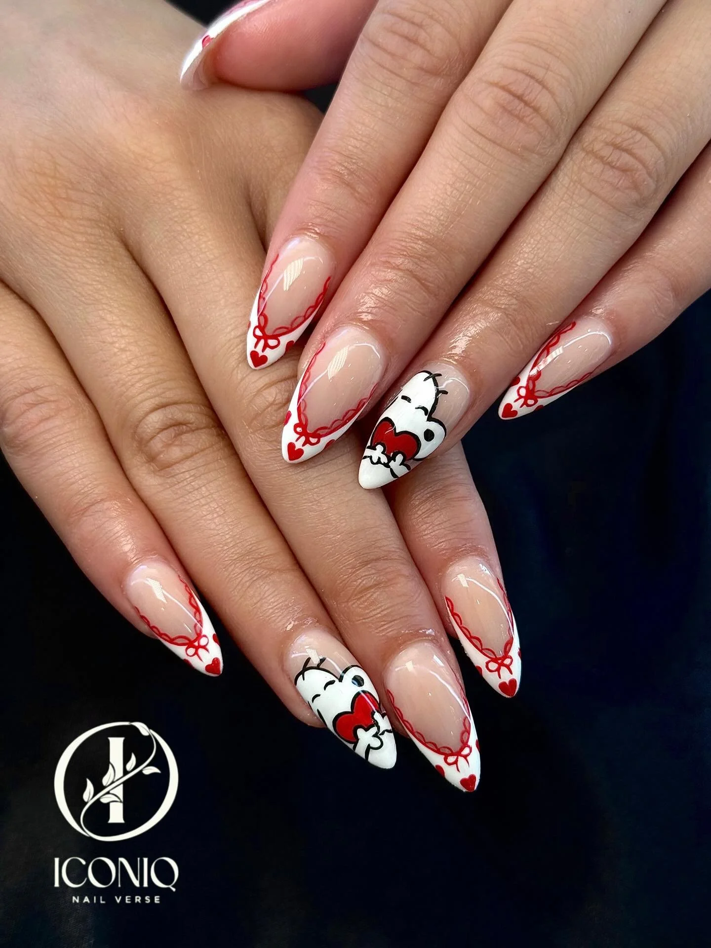 Hello Kitty nail art Richmond TX — red bow French tip stiletto nails at Iconiq Nail Verse nail salon