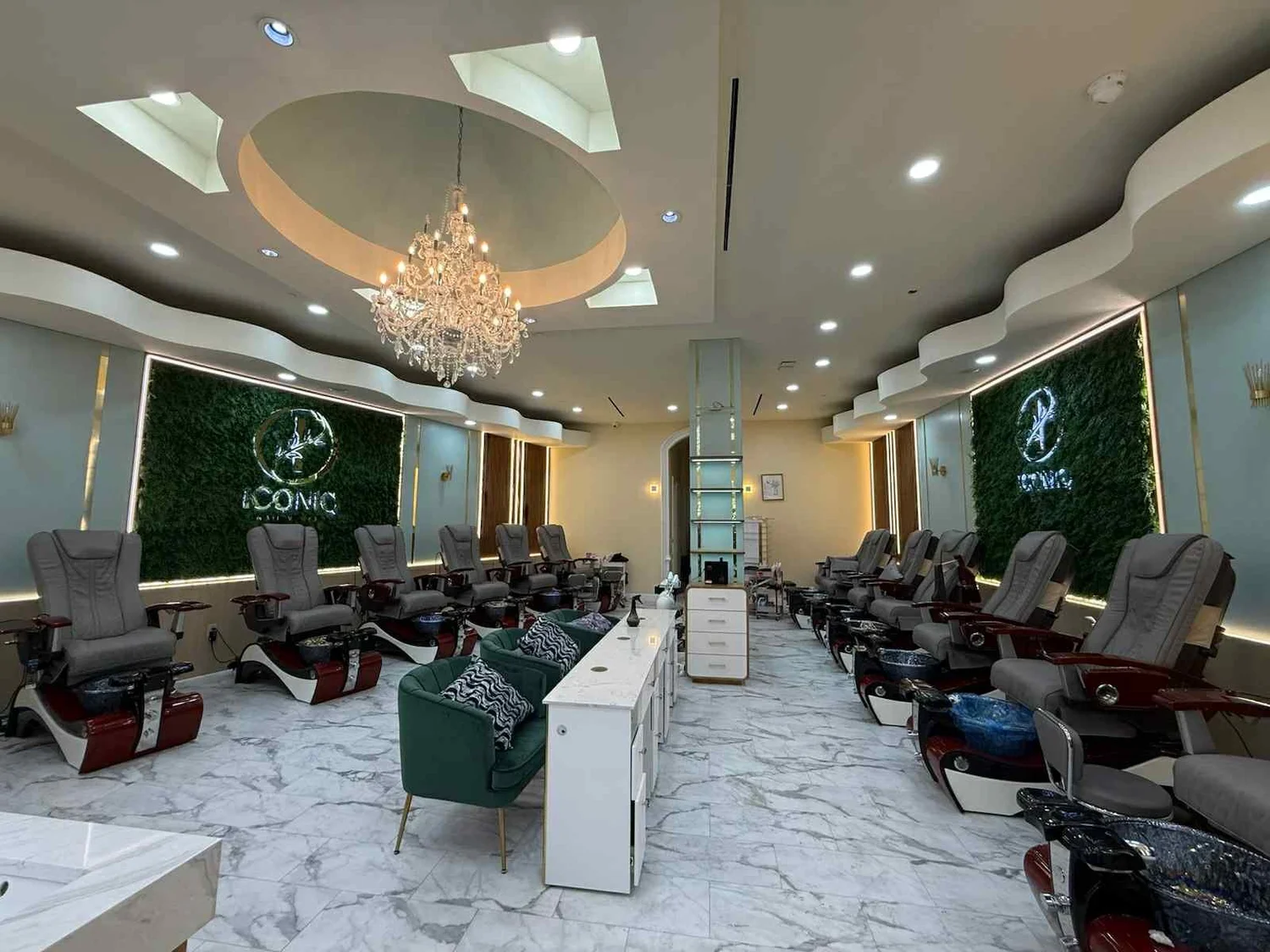 Inside Iconiq Nail Verse nail salon near Katy TX with luxury pedicure chairs and chandelier