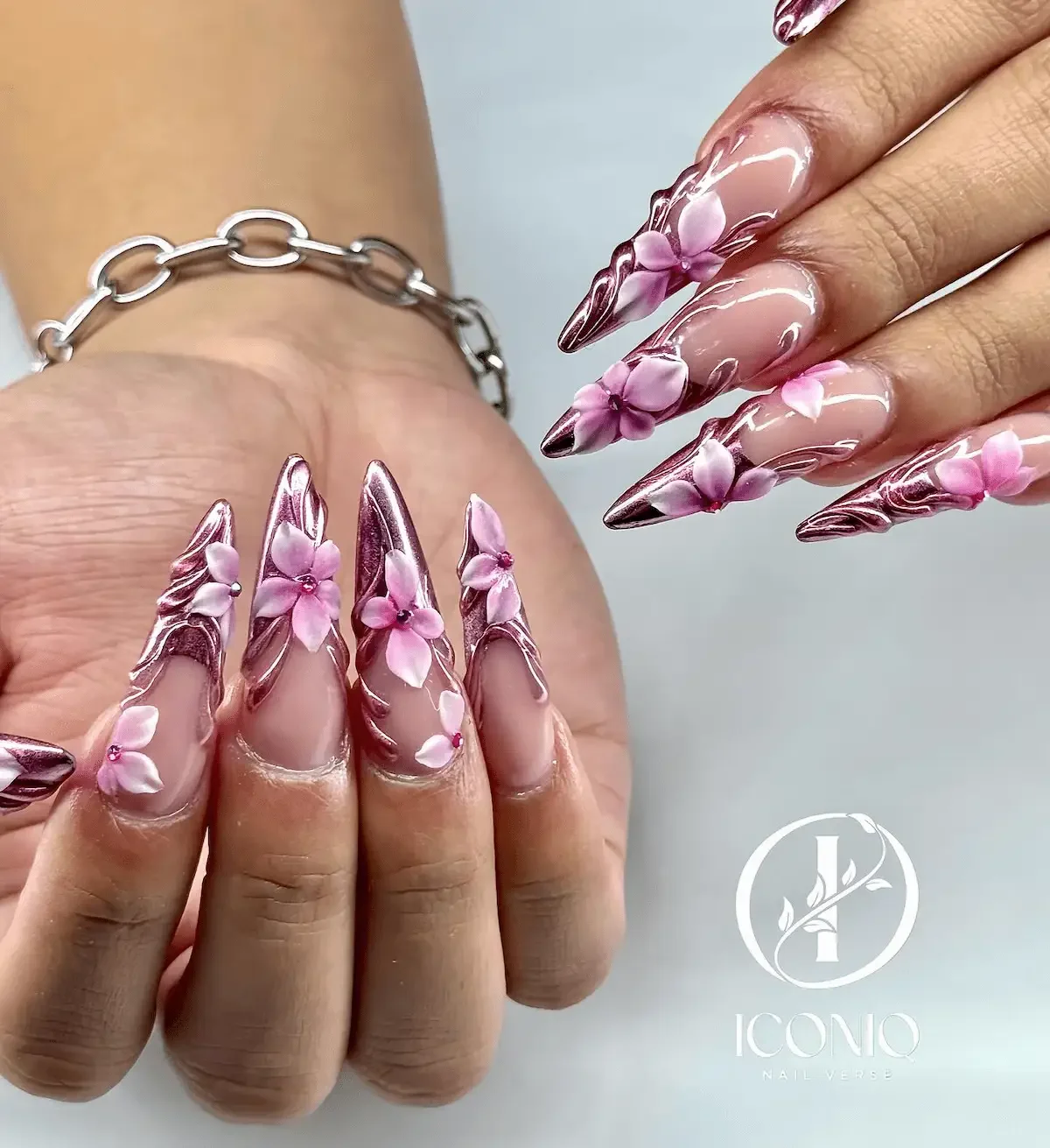 Floral French tip nail art with pink flowers at Iconiq Nail Verse Richmond TX