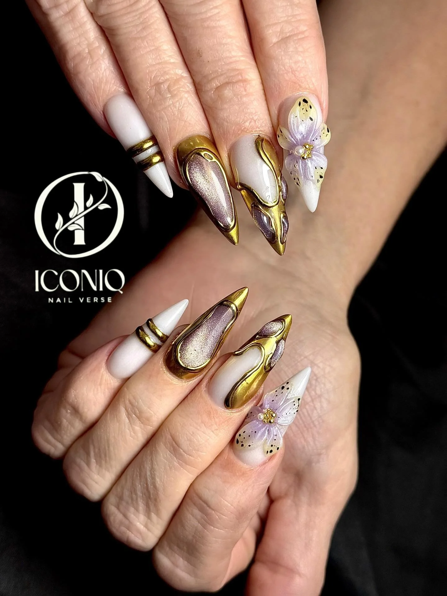 White and gold 3D floral stiletto nail art at Iconiq Nail Verse Richmond TX