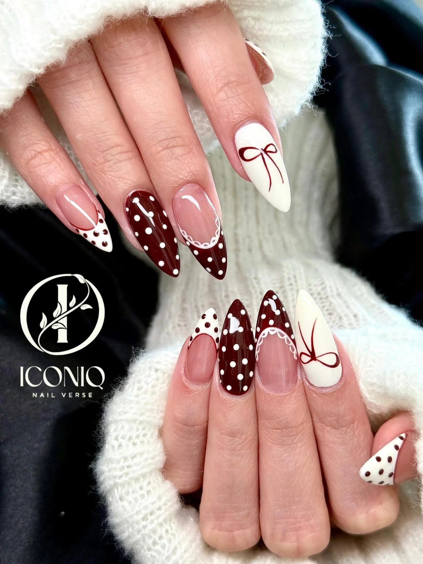 Burgundy polka dot and bow nail art design at Iconiq Nail Verse Richmond TX