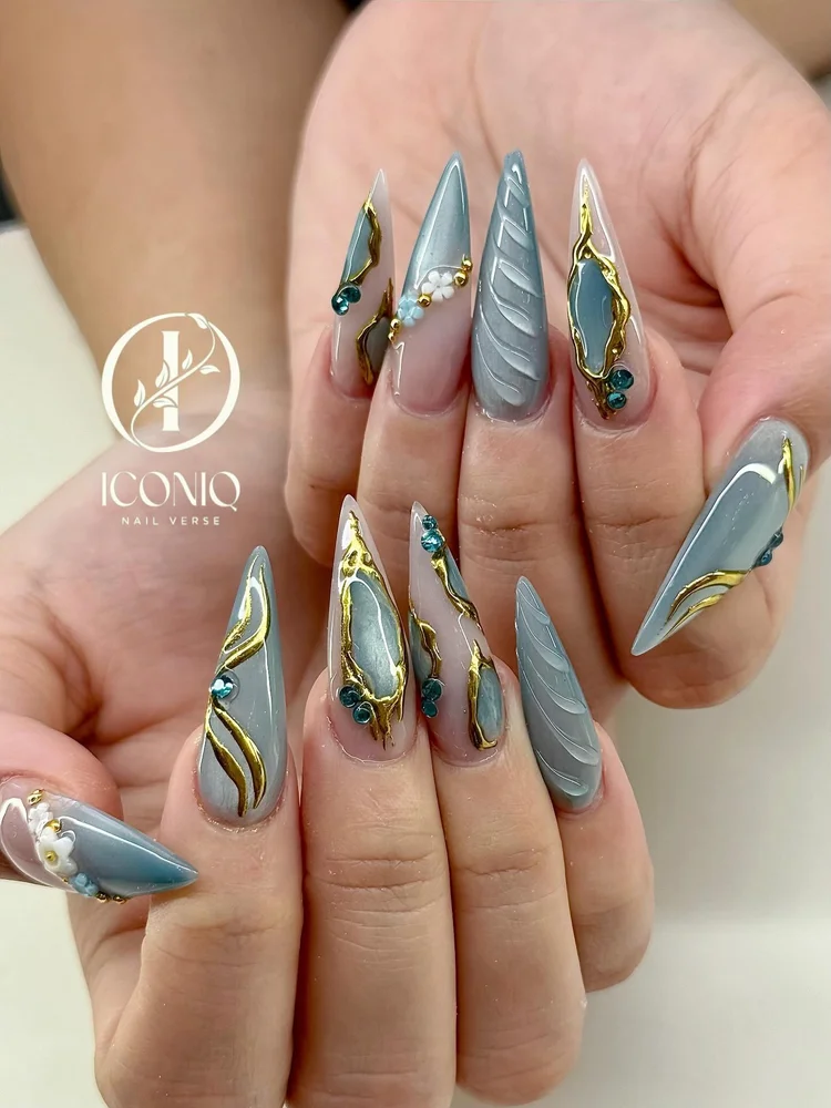 Stiletto nail art with gold accents at Iconiq Nail Verse near Katy TX