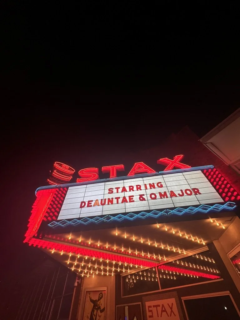 The Stax theater marquee at night with red neon lights, displaying the text 'Starr DeAuntae & Q Major' under the theater's name.