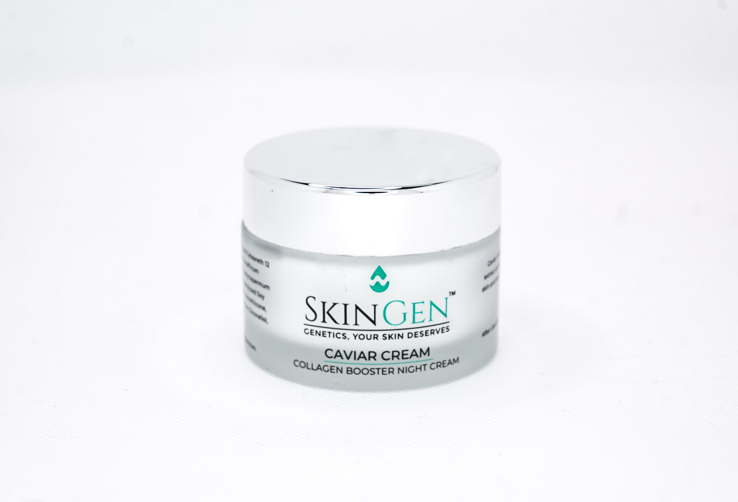 A jar of SkinGen Caviar Cream, a collagen booster night cream, with a silver lid, on a white background.