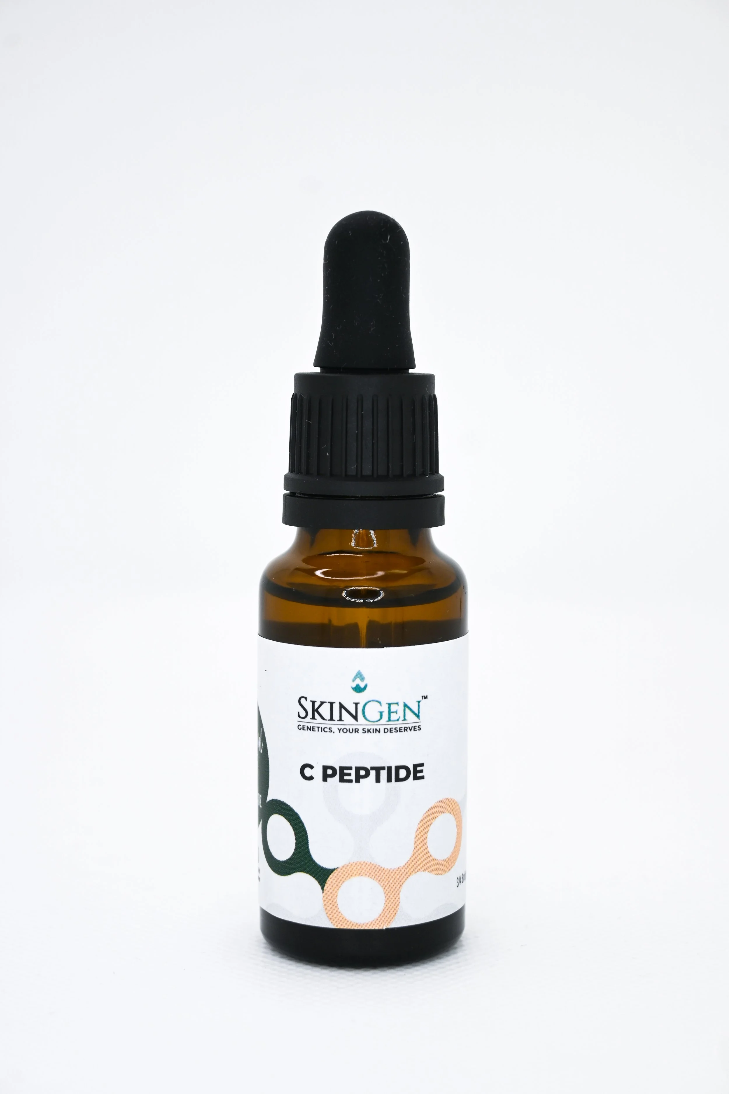 A small brown glass bottle with a black dropper cap labeled 'SkinGen C Peptide' on a white background.