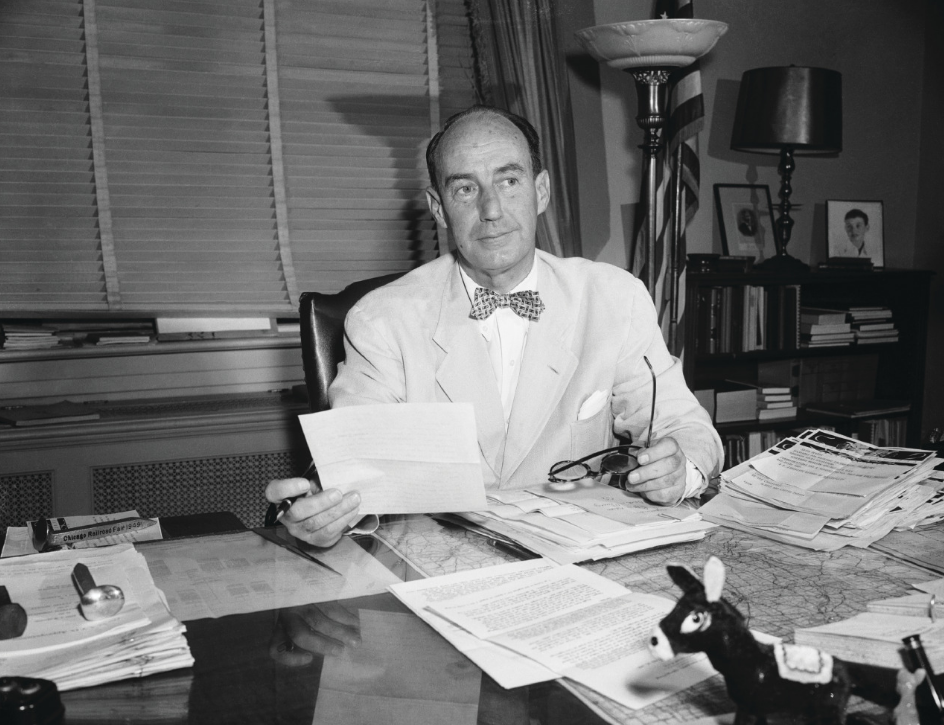 1952 Governor Adlai Stevenson working at his desk 