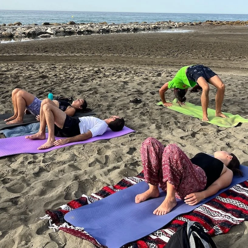 Big wheel pose as a little challenge during beach yoga.jpg