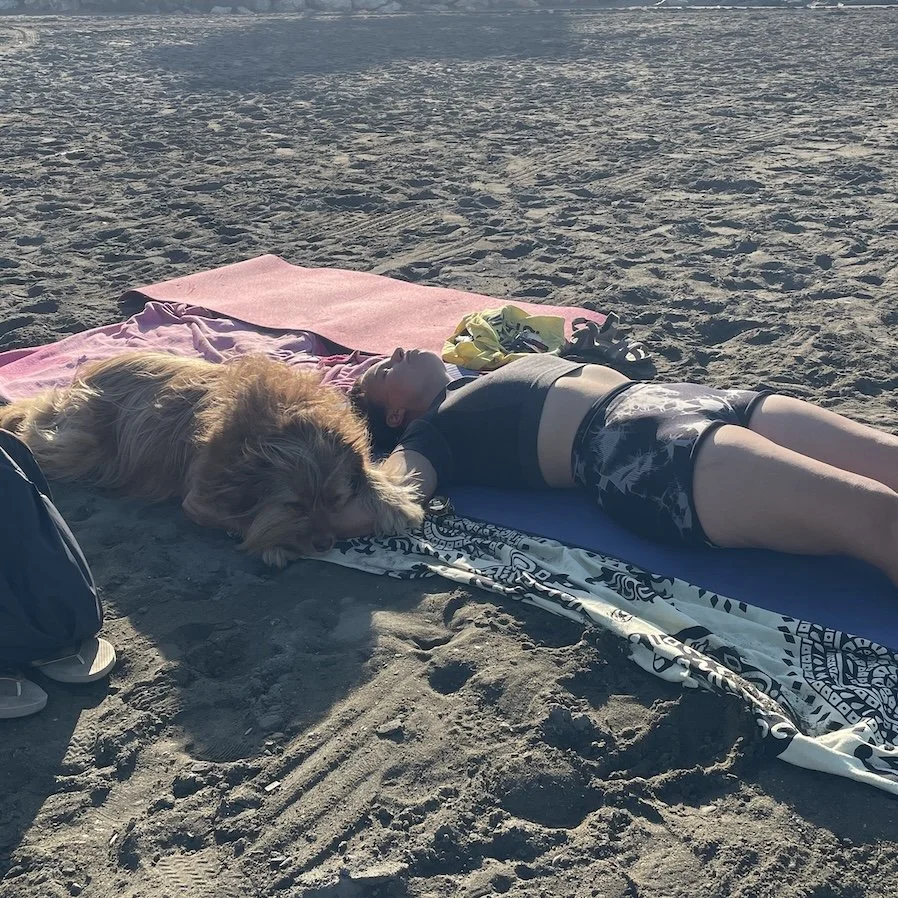 Fury company during beach yoga.JPG