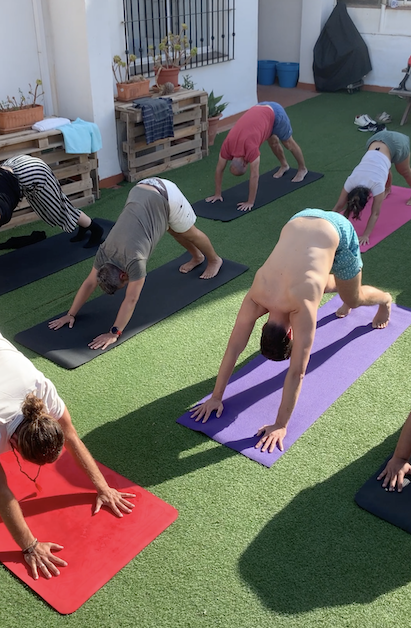 Downward facing dog at Rooftop Yoga.png