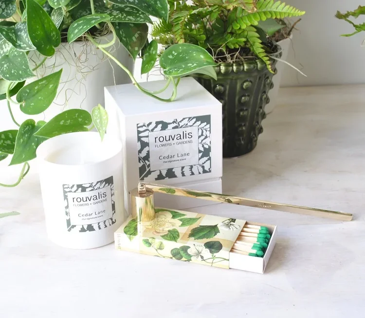 florist with flowers and candles delivered